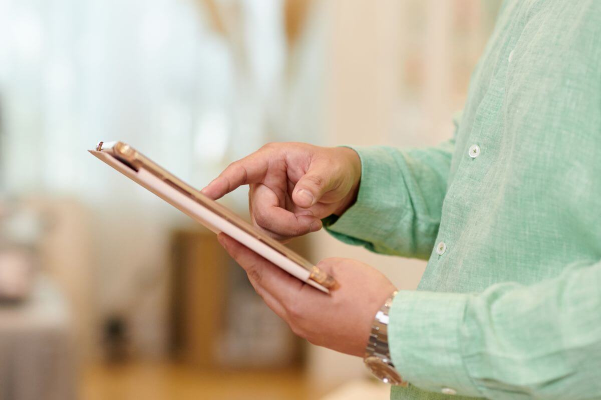 An image of a man using a tablet device.