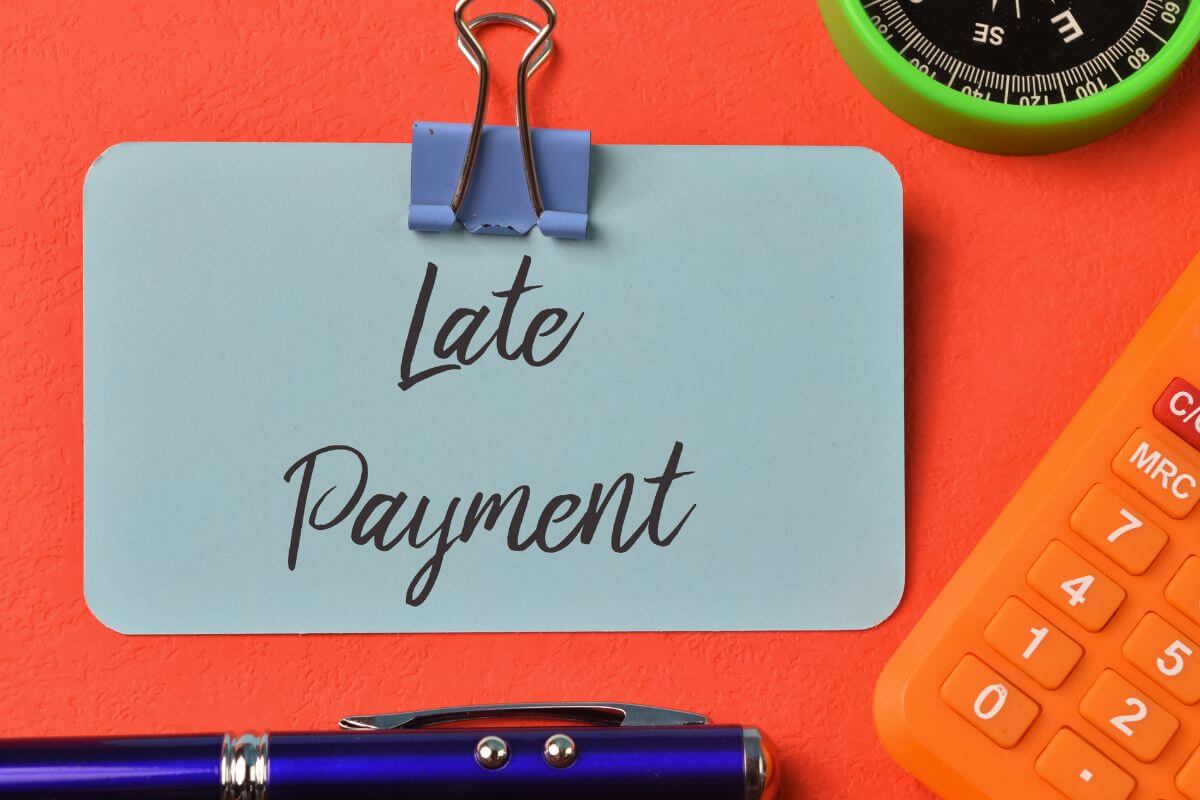 A picture of a paper with late payment wording.