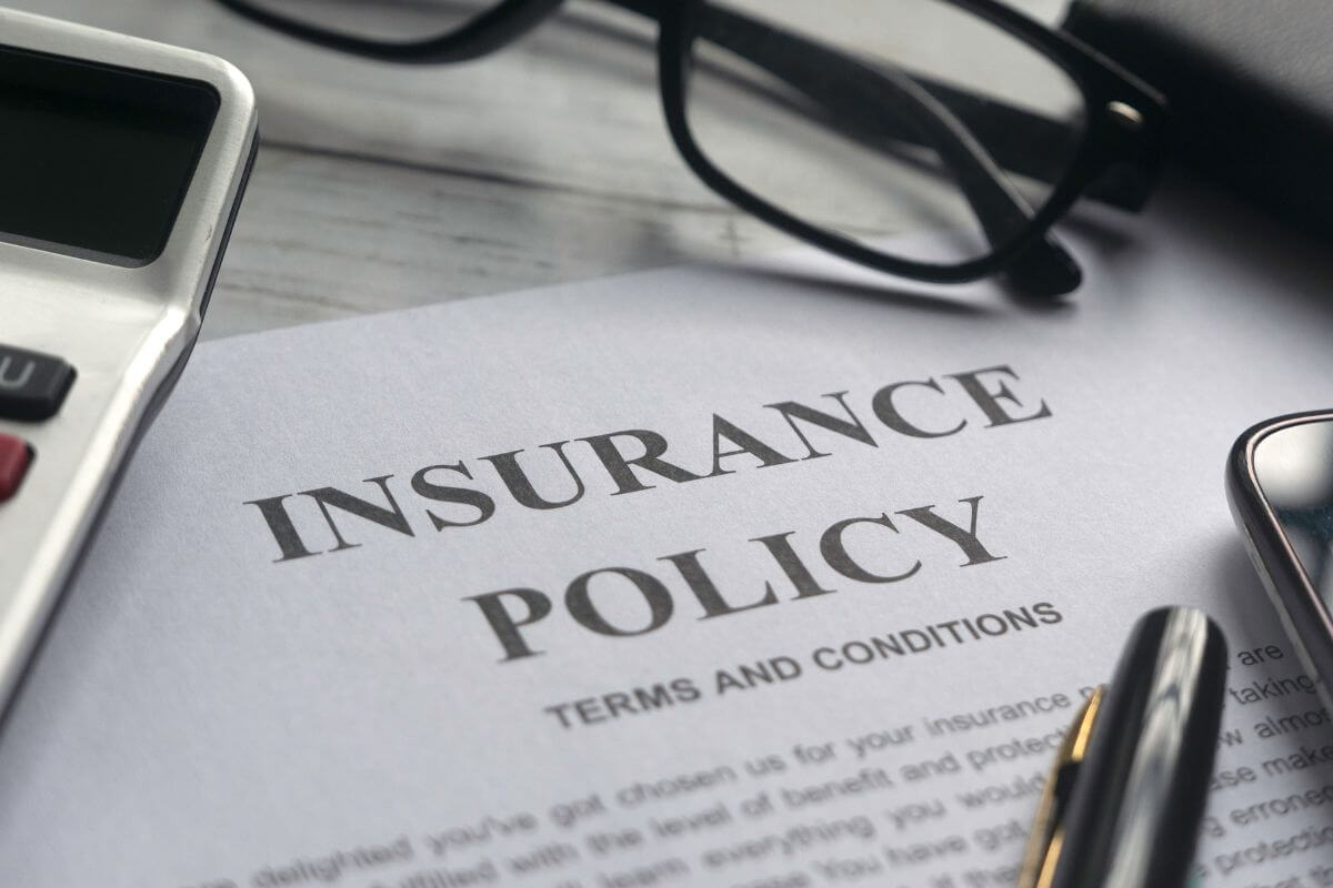 A picture of a paper with insurance policy wording.