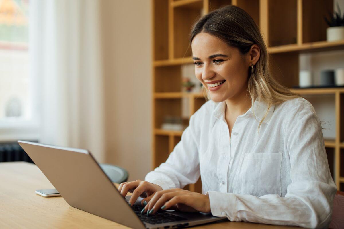 A picture shows a woman using a laptop.