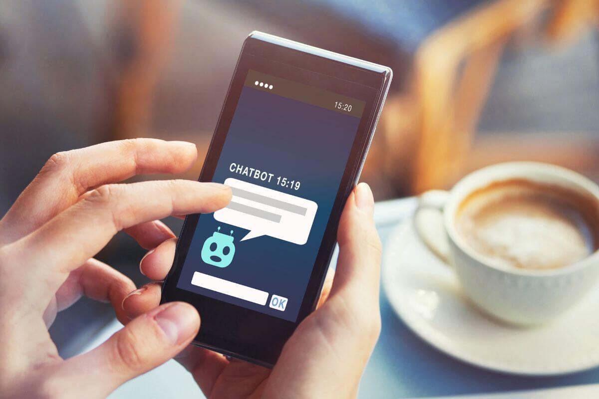 A picture shows a woman's hand using a phone.