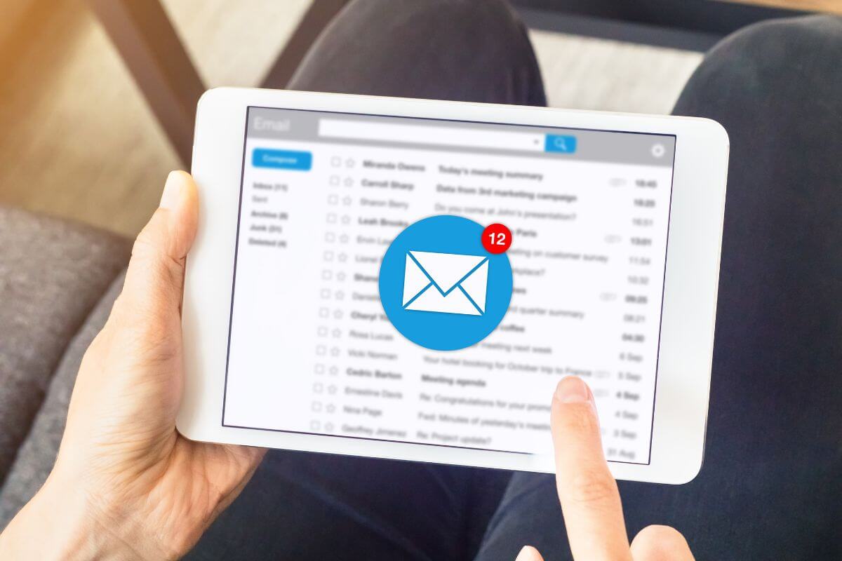 A picture of a woman checking her email inbox.
