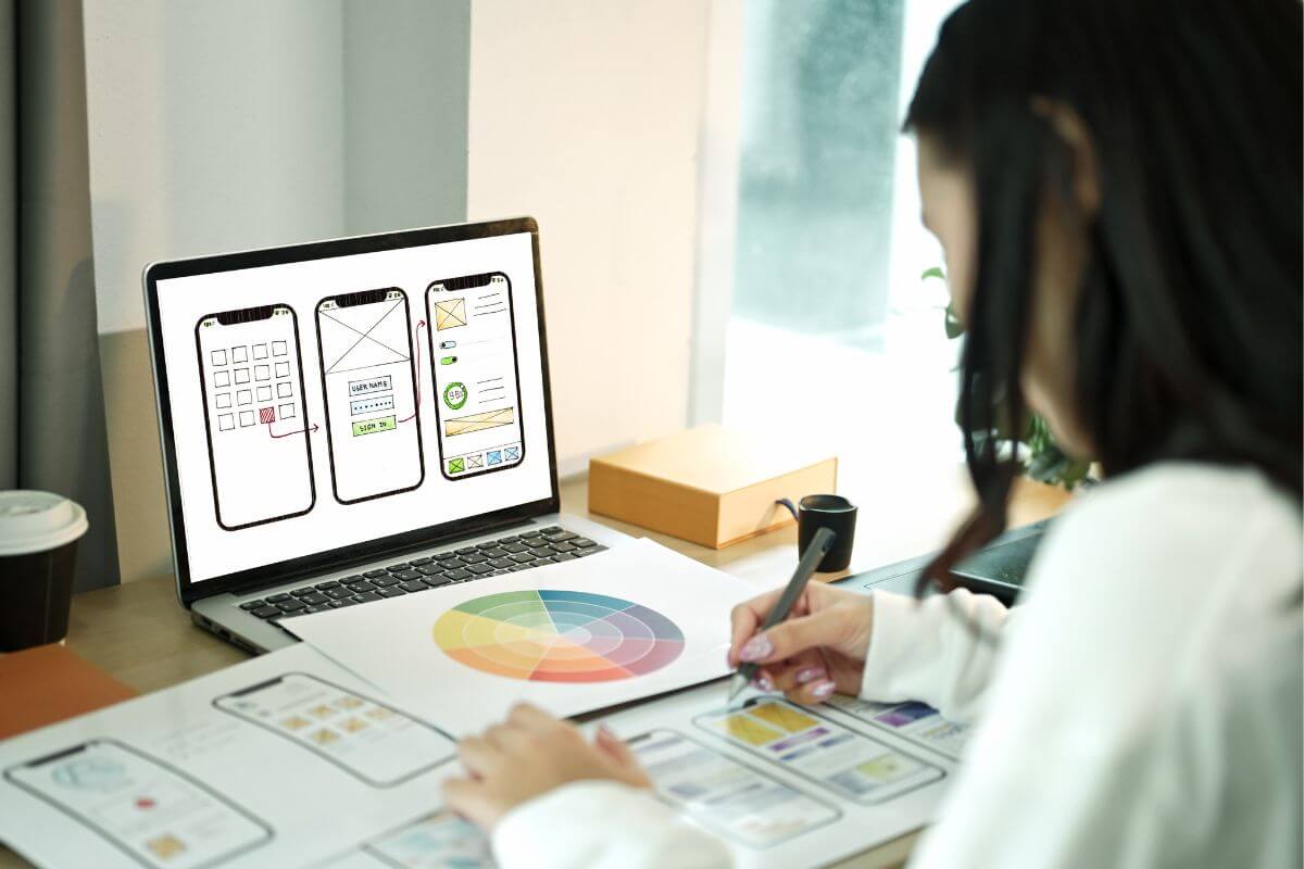 An image of a woman designing an App.