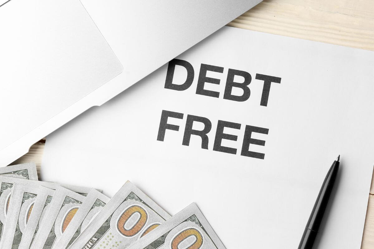 A picture of a paper with debt-free written on it.