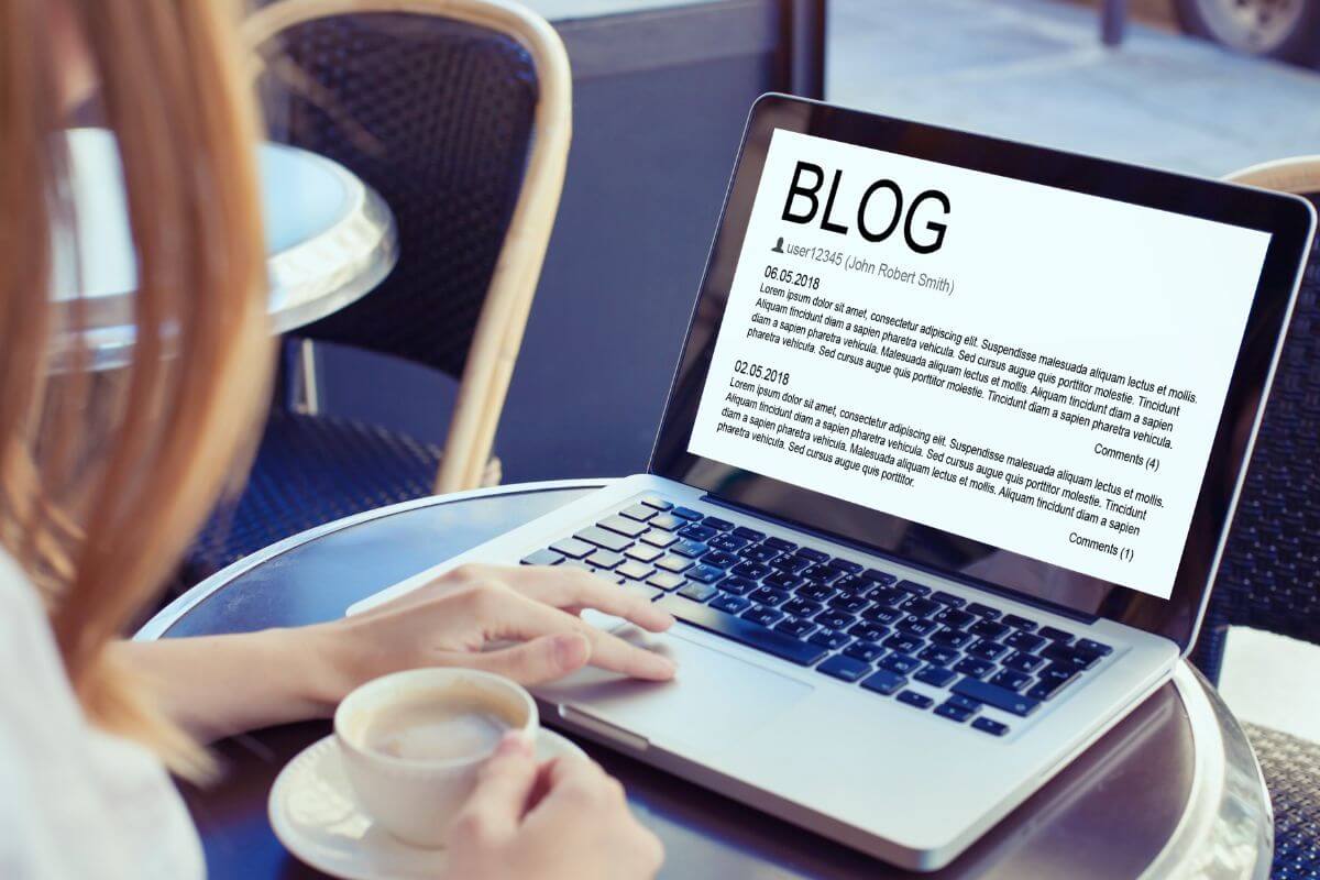 An image shows a woman making a blog.