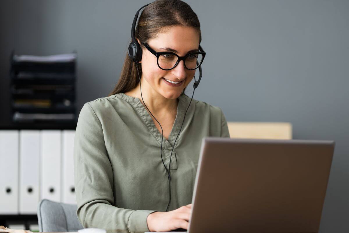 A picture of a woman using a laptop.
