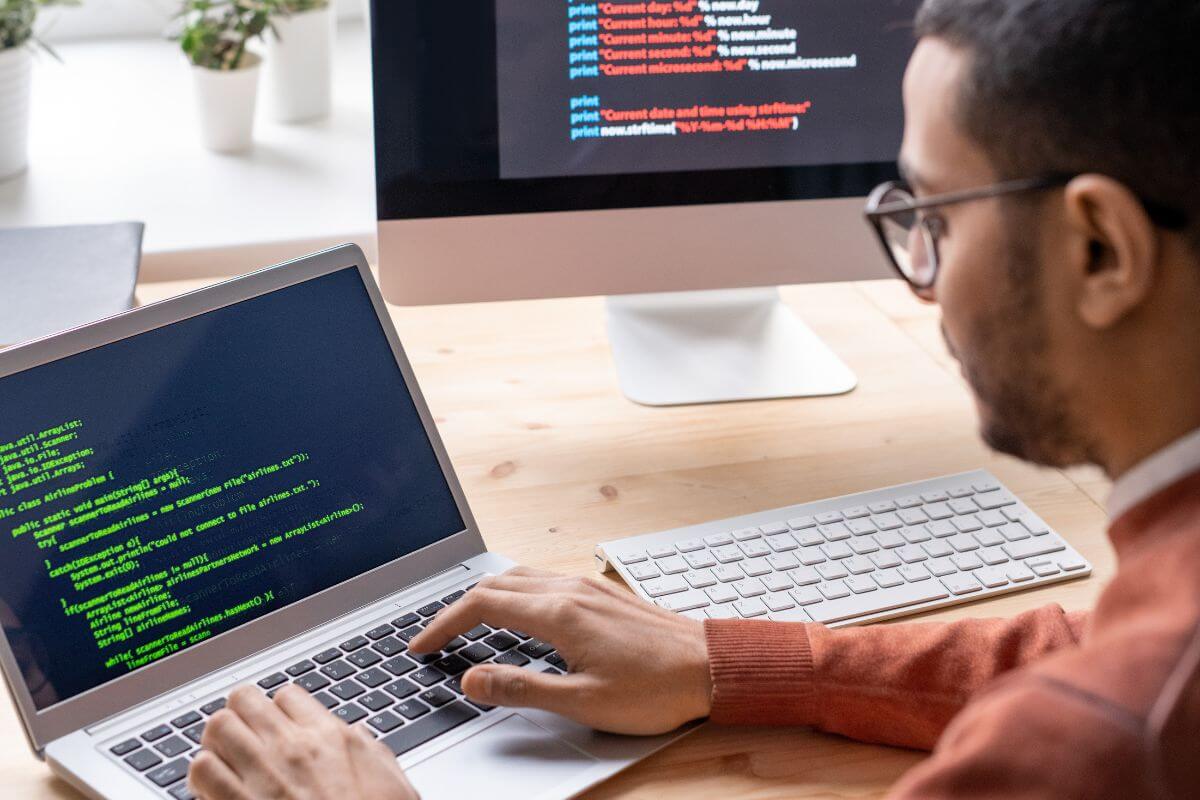 A picture shows a man coding.