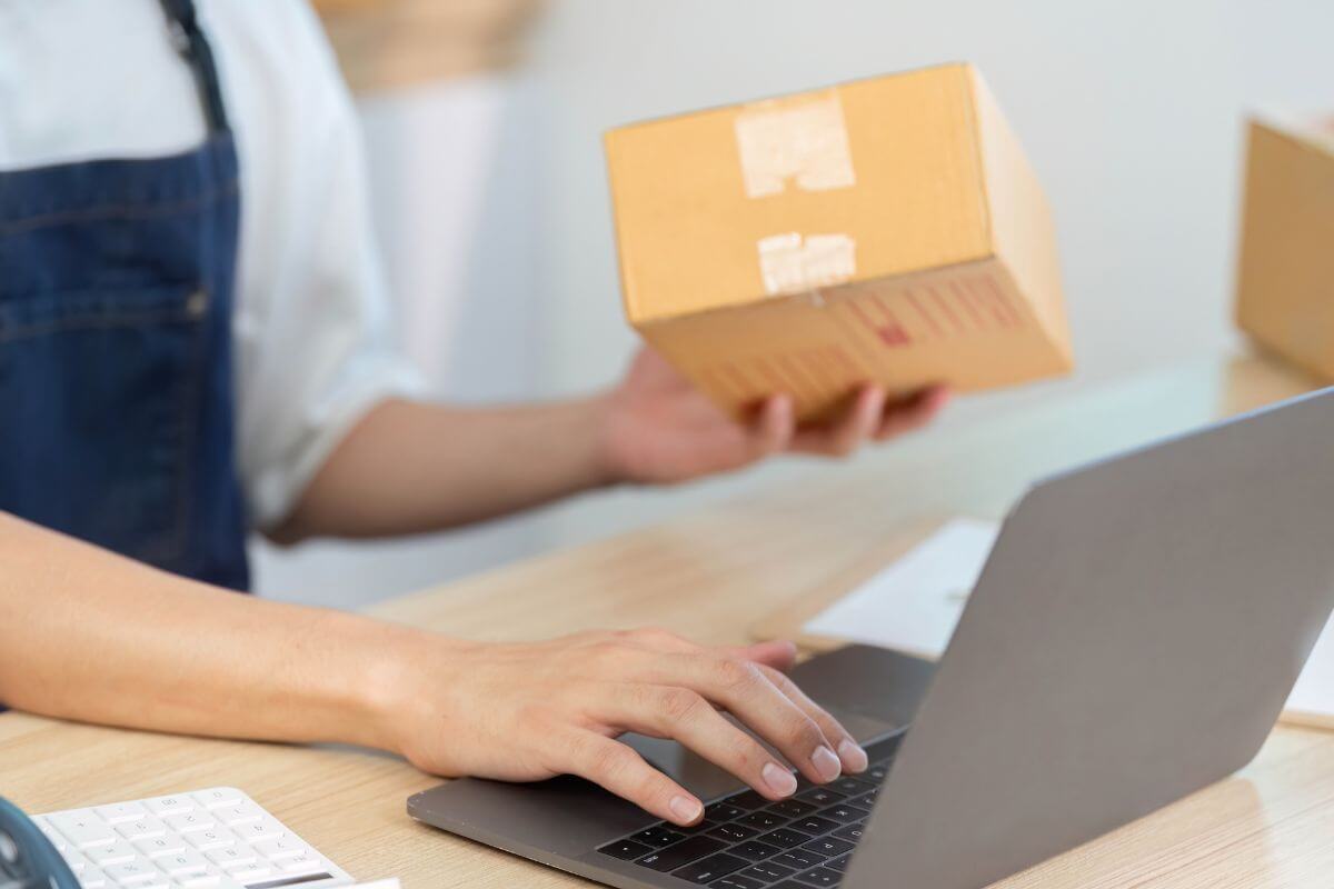 An image of a woman processing an order online.
