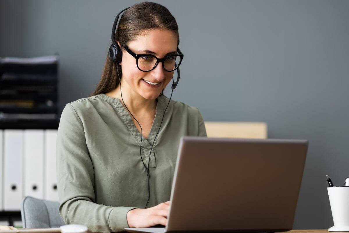 A picture of a woman using a laptop.