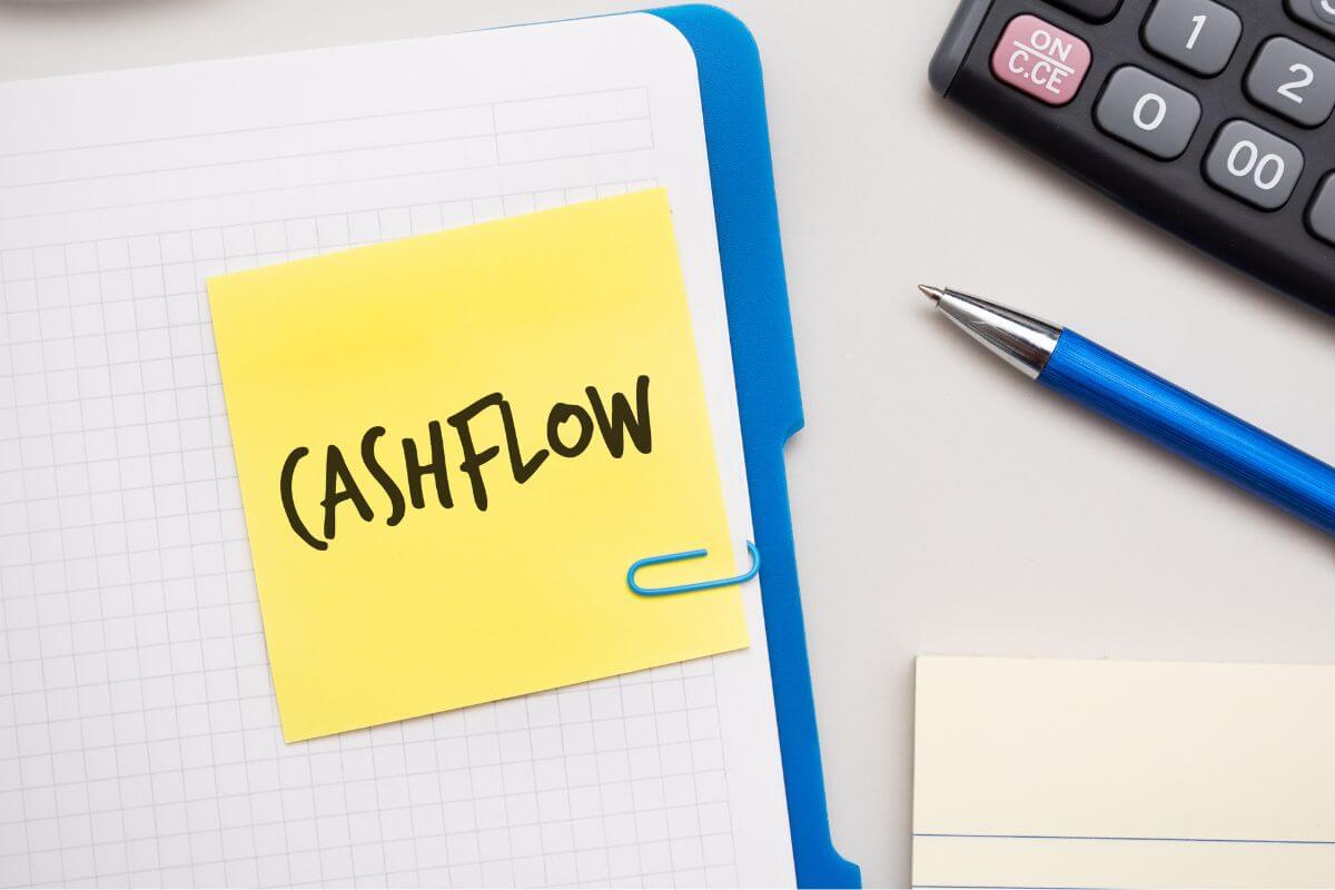 An image shows a paper with cash flow wording.