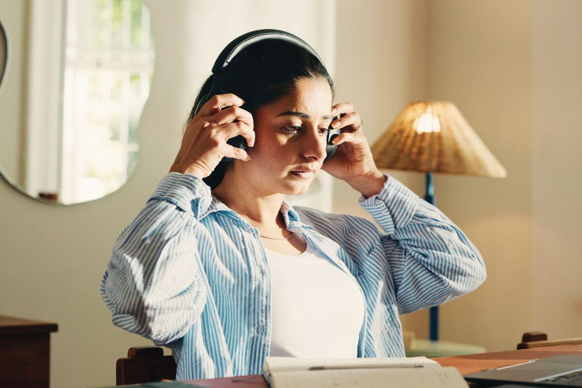 An image of a woman listening to something.