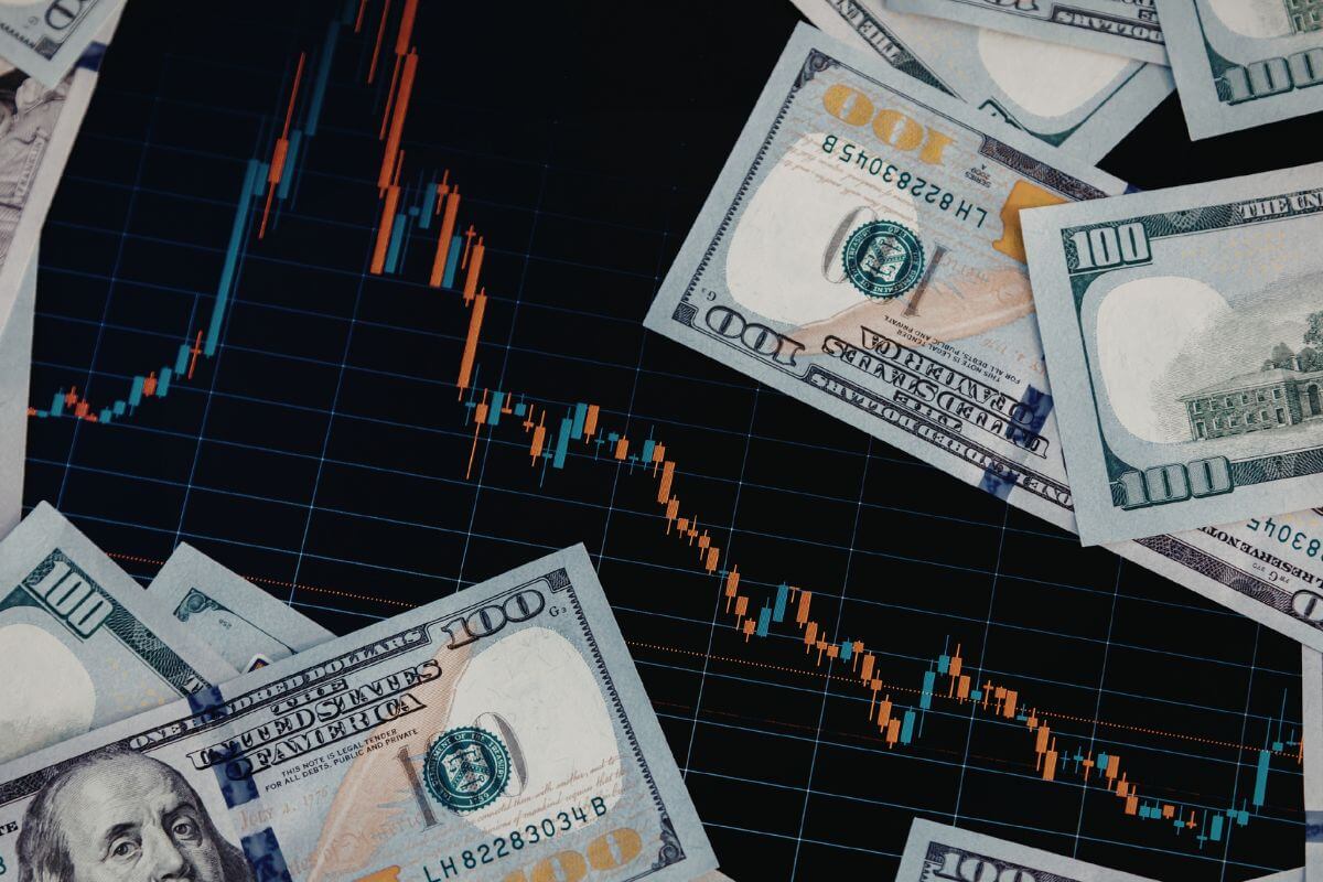 A picture of a graph and money.