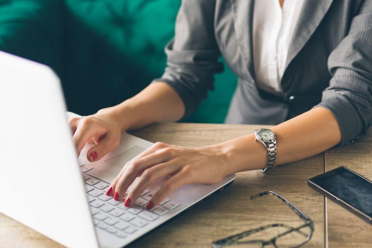 A picture shows a woman using a laptop.