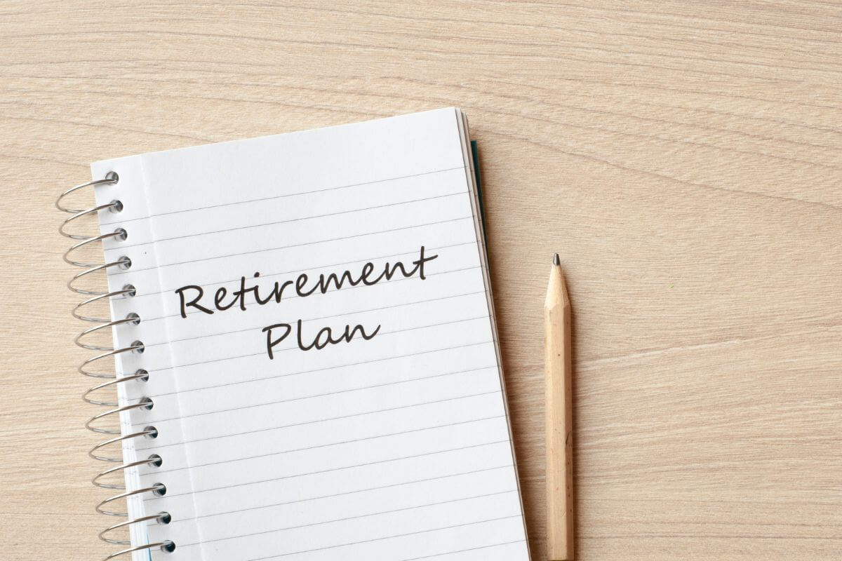 An image shows a notebook with retirement plan wording.