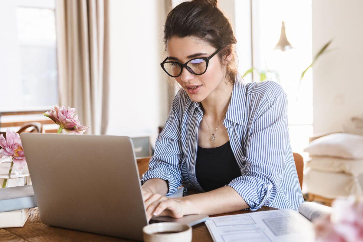 An image of a woman working on her laptop.