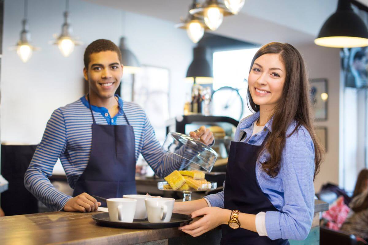 An image shows employees working in a coffee shop.