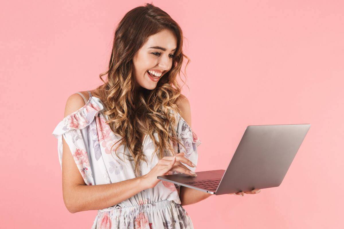 An image shows a woman using a laptop.