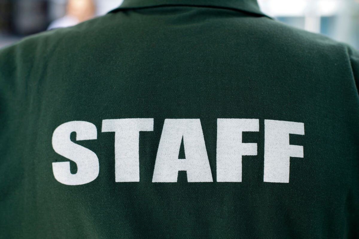 A picture of a shirt with staff printing.