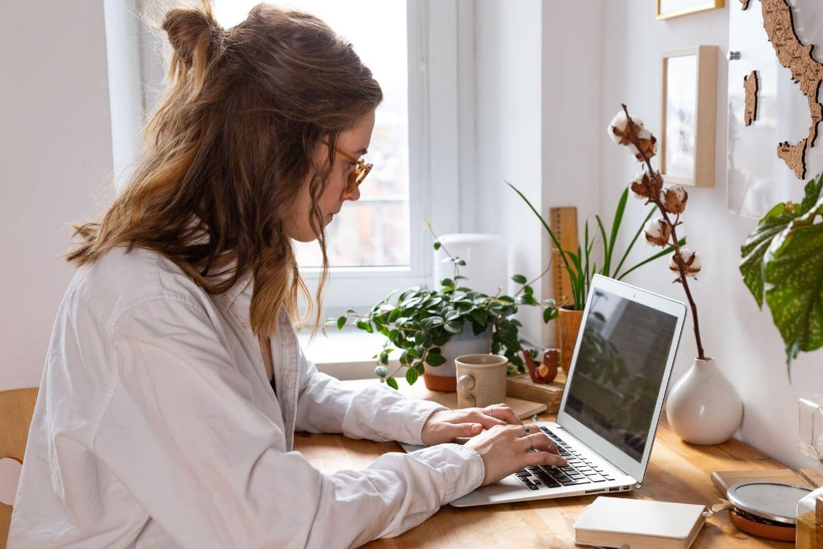 One photo shows a woman typing on a laptop.