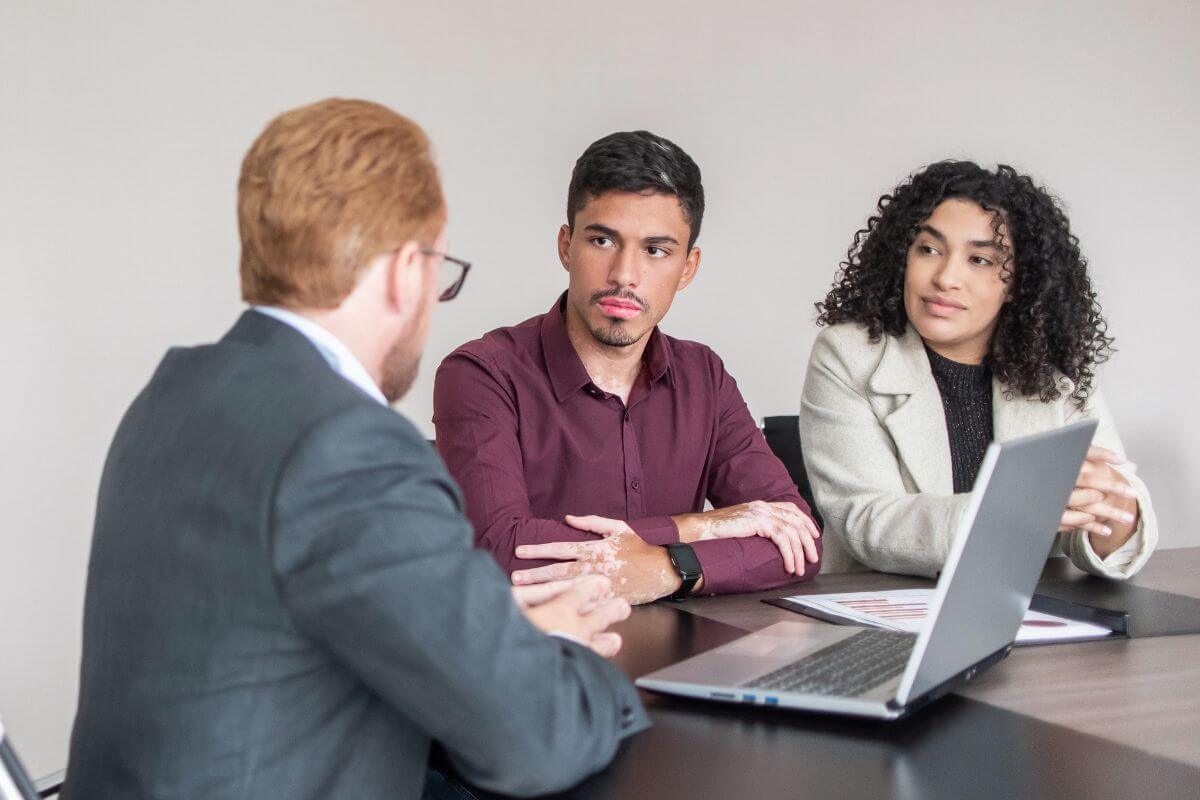 A photo of a financial advisor meeting with his client.