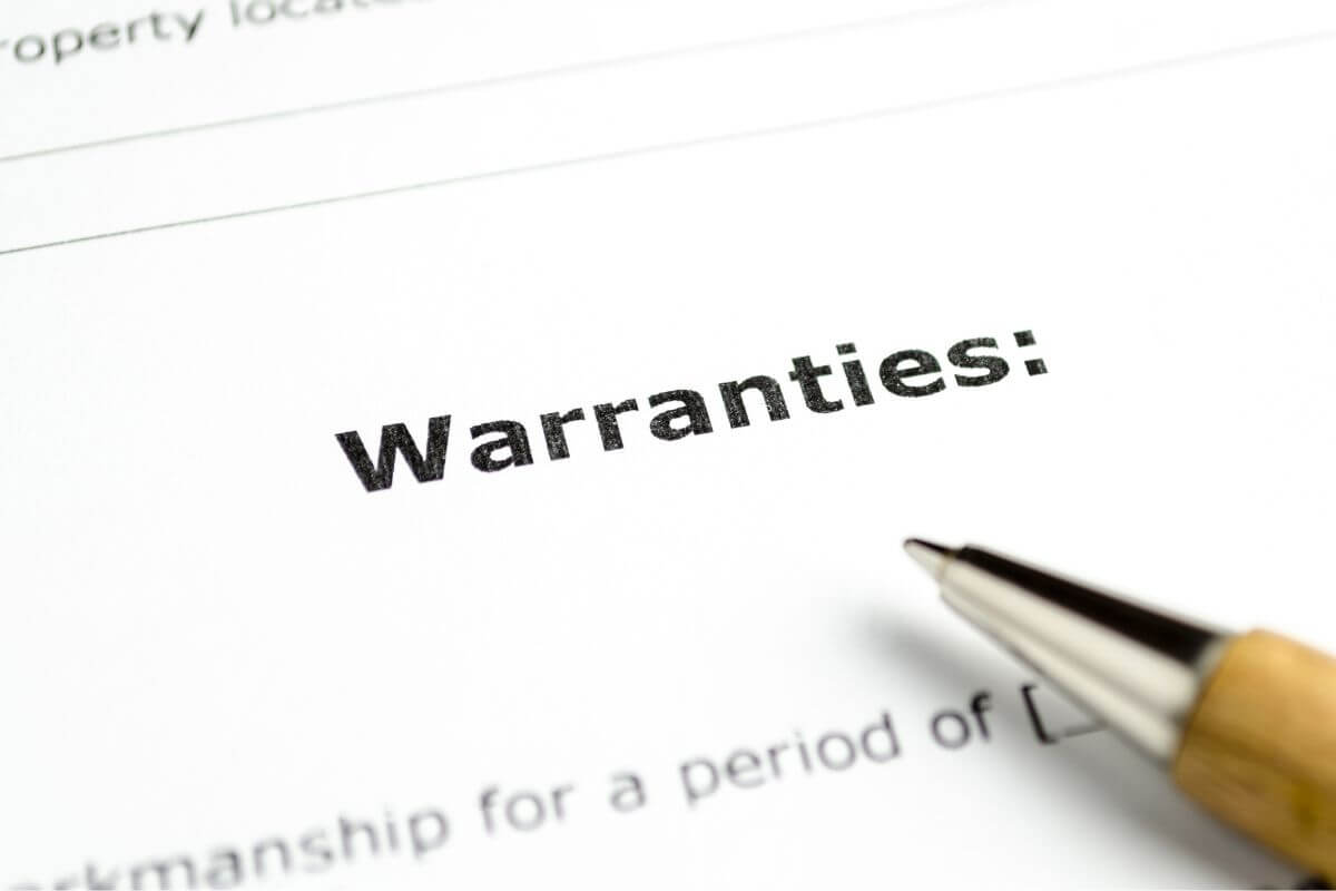 A picture shows a paper with the word "warranties".