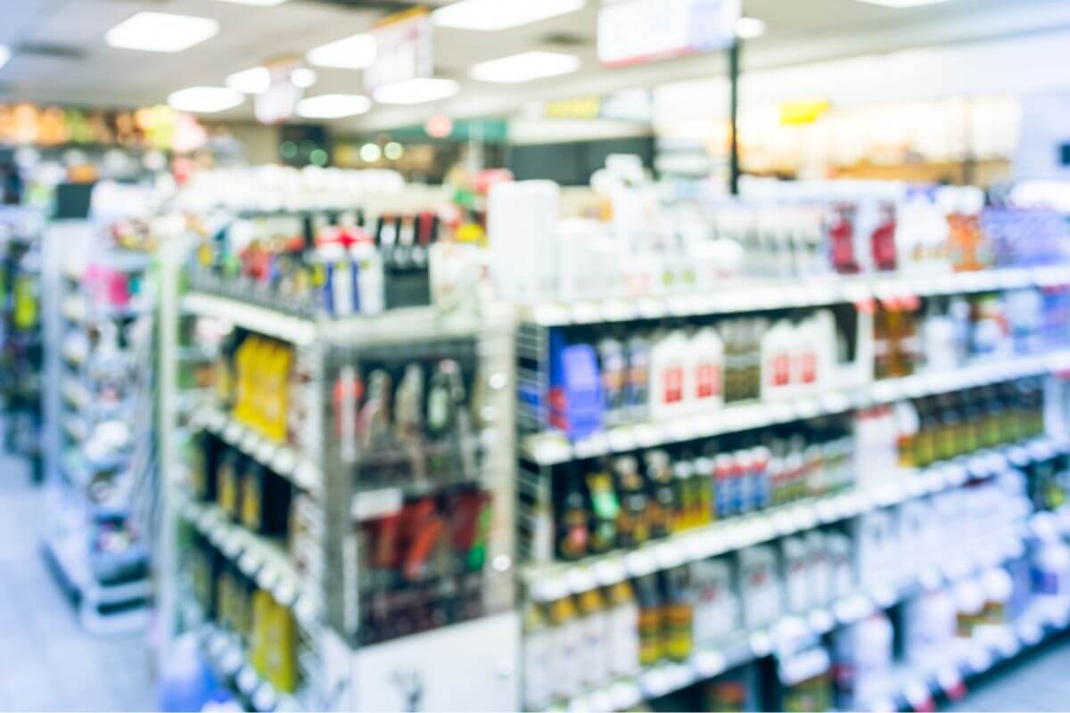 An image shows a convenience store with products.
