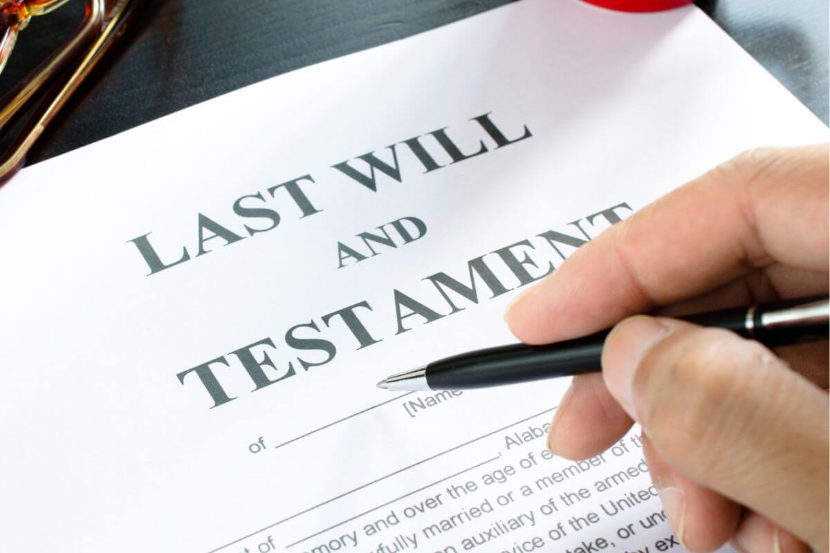 A picture shows a man's hand filling out the document.