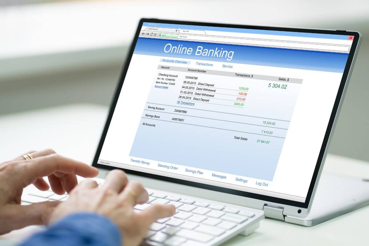 A picture shows a person checking her bank online.