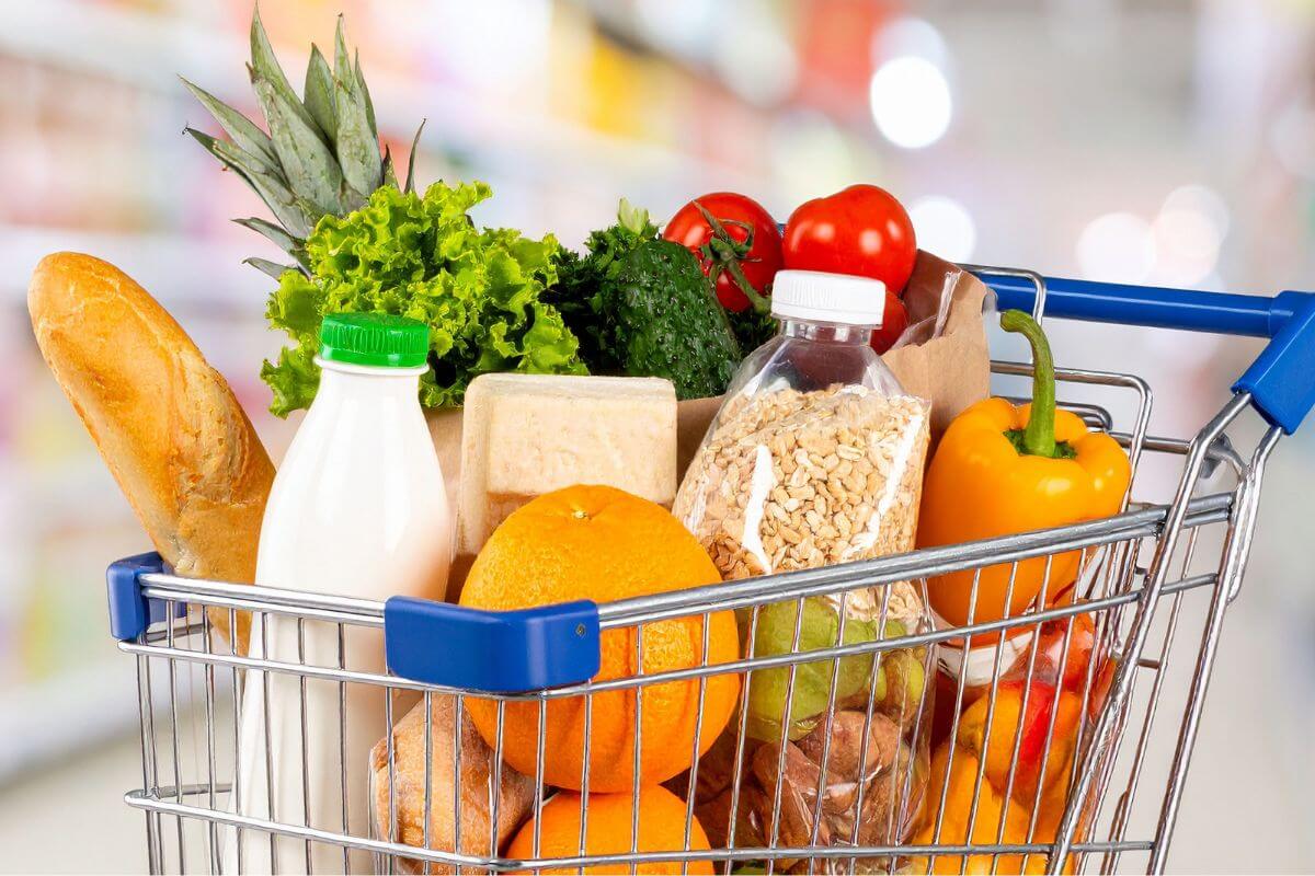 An image of a cart full of grocery items.