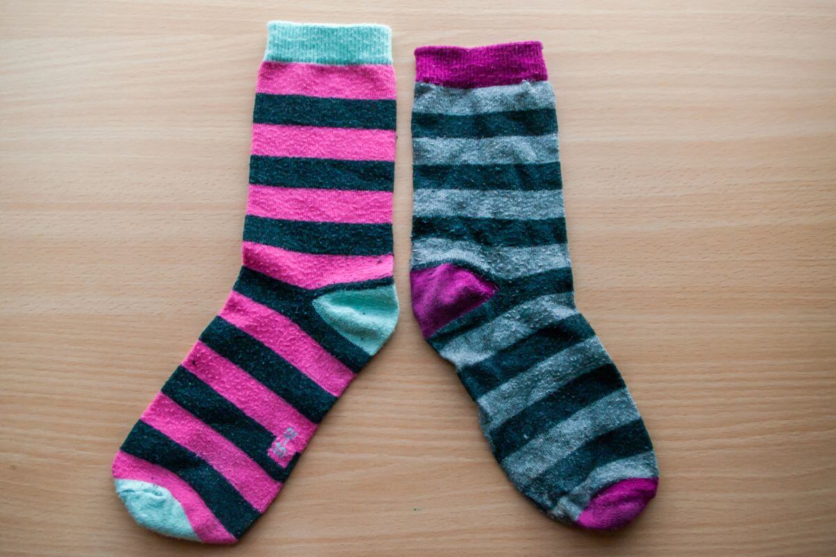 An image shows a mismatched sock.