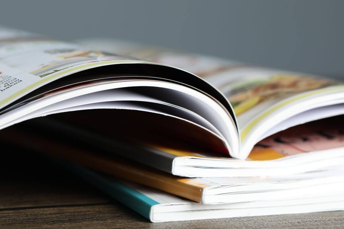 A picture shows magazines on the table.