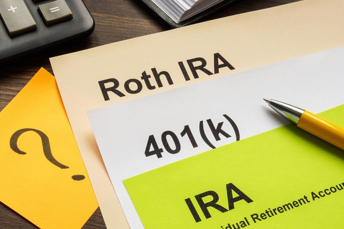 A picture shows papers with retirement account types.